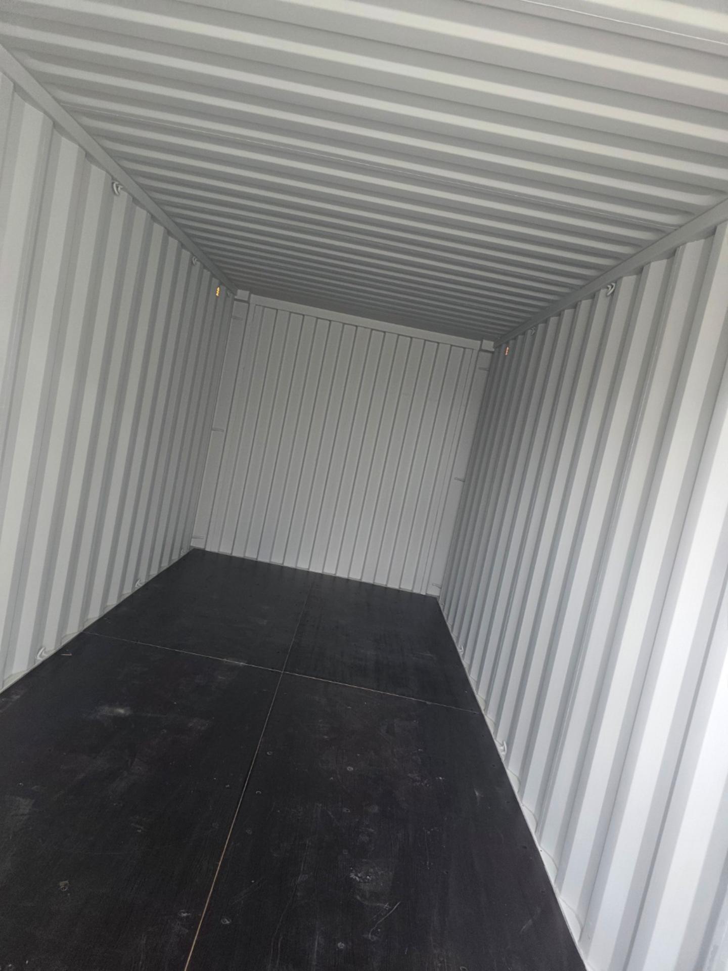 Clean interior of 20ft one trip shipping container with plywood floor 