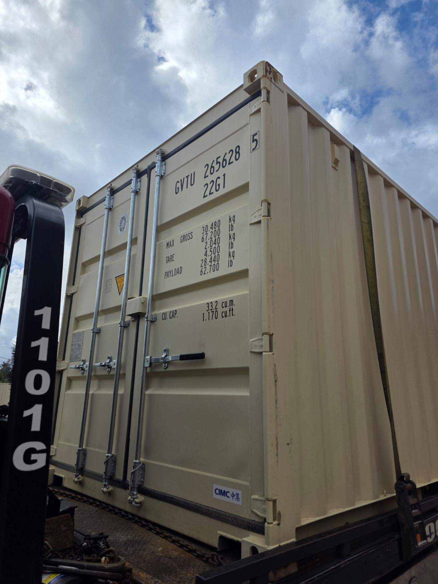 Close-up of one trip container doors showing Max Gross, Tare, and Payload weight specifications during delivery