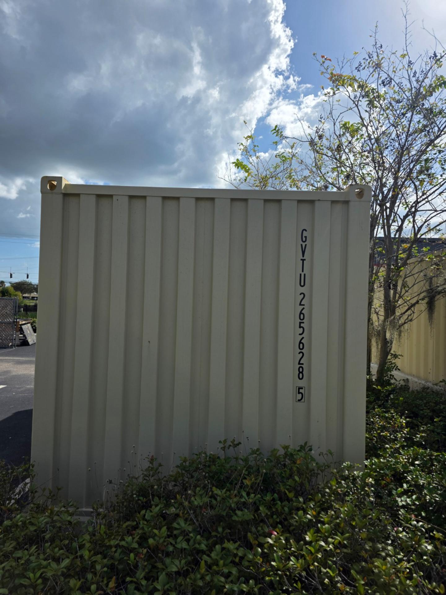 20ft one trip shipping container placed on paved parking lot surface