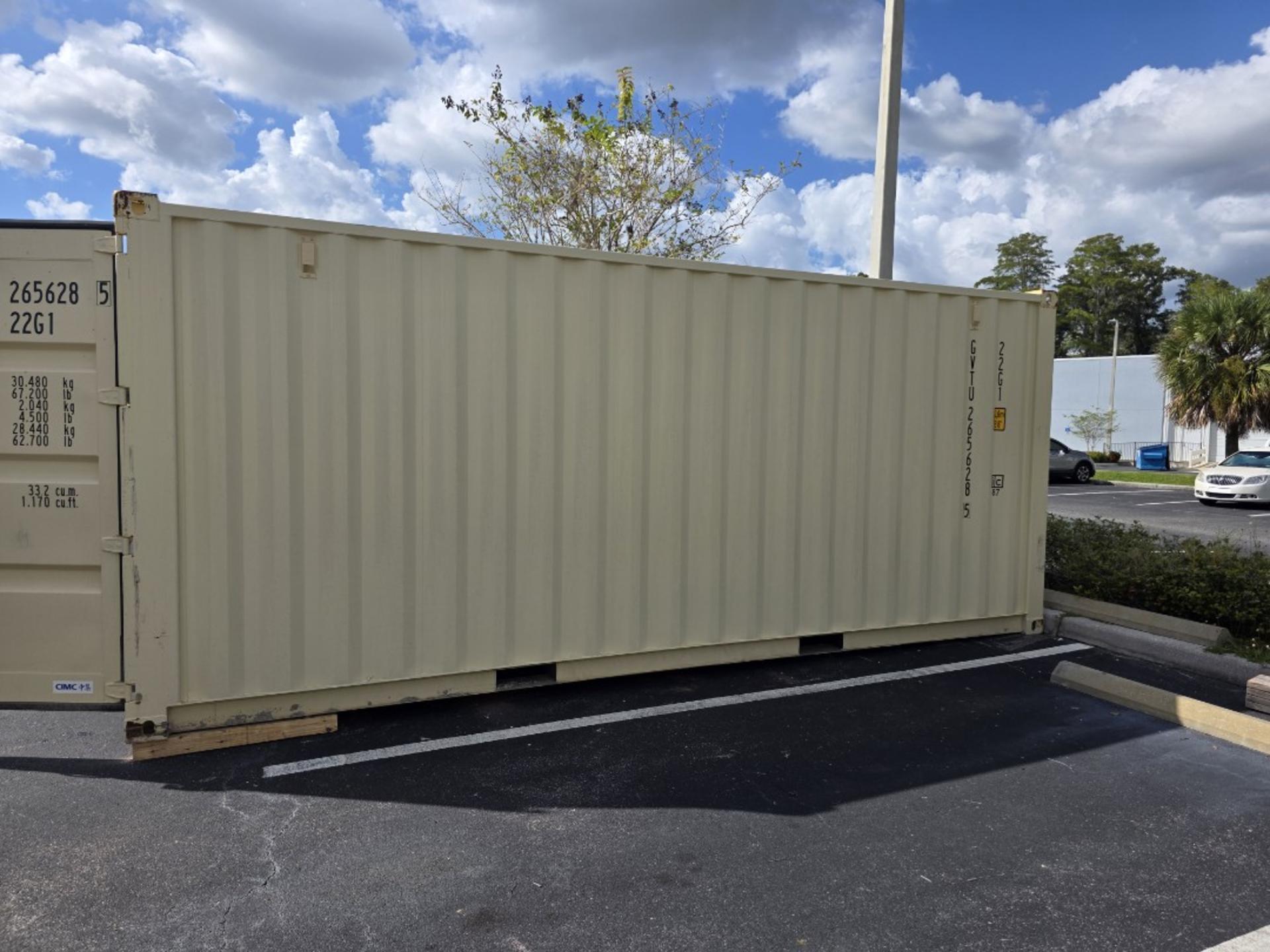 Side view of 20ft one trip container positioned in a commercial parking lot space